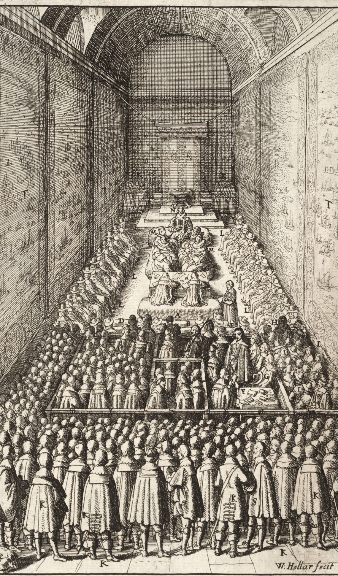 A print from a book/newspaper depicting the early 17th century House of Lords Chamber which is a long room with high ceilings. In this print there are multiple people most of which their faces are not on show. It is titled: The manner and form of the Arch-Bishops Trial in the House of Peers.