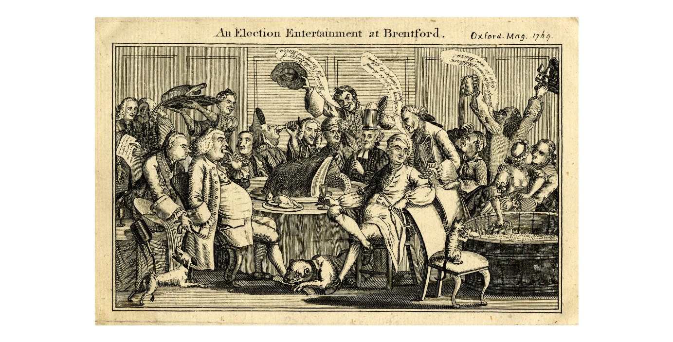 Engraving showing a group of men wearing wigs and frock coats enjoying a feast. Two women are serving them and a dog is shown eating a bone at one of their feet.