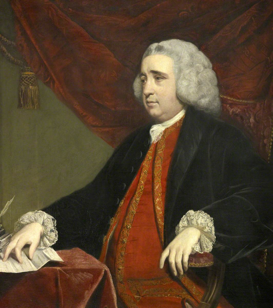 Painting of Henry Fox. A man is sat on a red upholstered chair facing slightly to the side. A red curtain is behind him. He has grey curled hair and a pale complexion. He is wearing a white shirt with lace cuffs, a red jacket and matching waistcoat with gold braid detailing and a black overcoat. One hand rests on a sheet of writing paper on a table, covered in a red tablecloth.