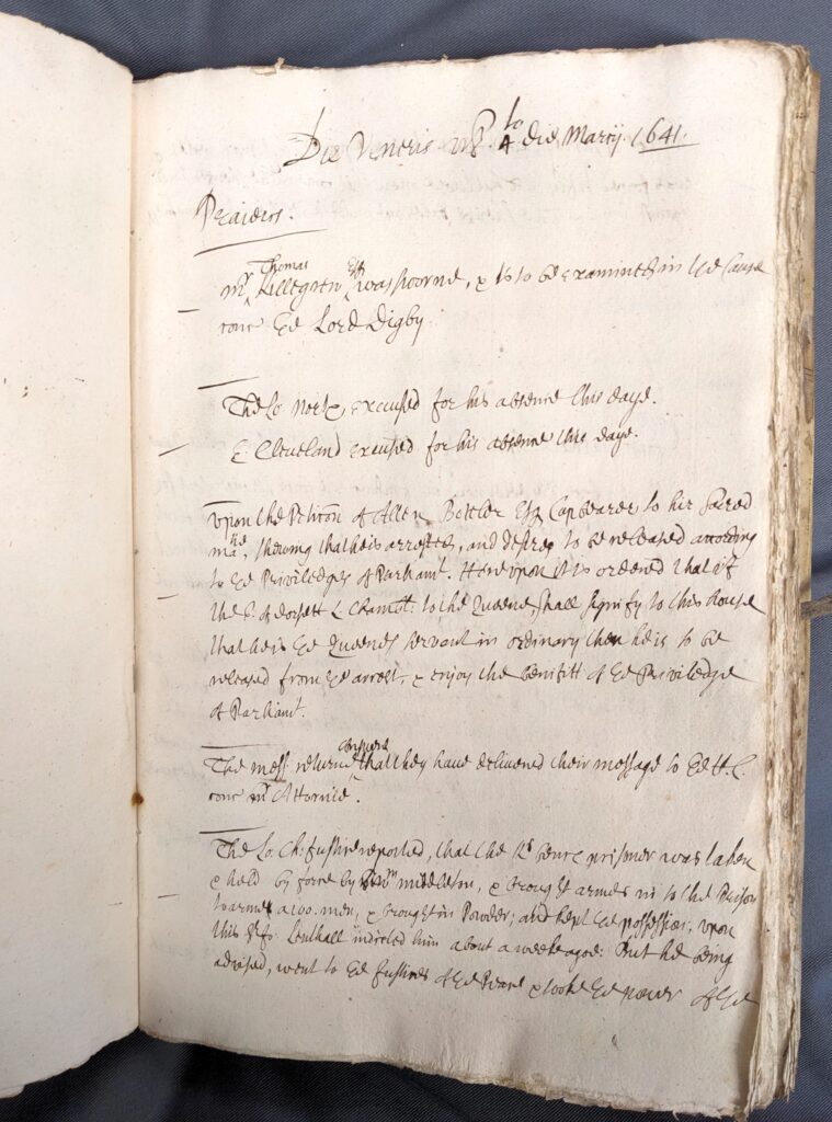 A coloured photograph of a manuscript page of handwritten text. The writing in illegible, but concerns a day's entry from the Scribbled Books kept by the Clerk of Parliaments, 4 March 1641/2.