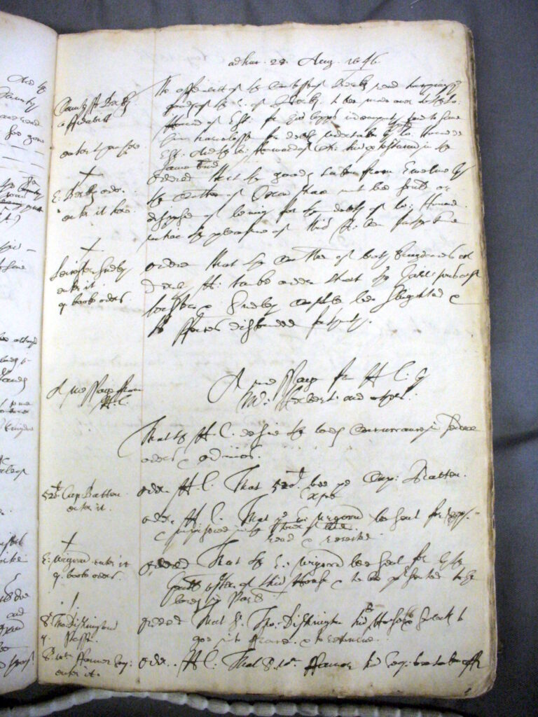 A coloured photograph of a manuscript page of handwritten text. The text is illegible, but concerns a day's entr from the Manuscript Minutes kept by the Deputy Clerk in the House of Lords, 28 August 1646.