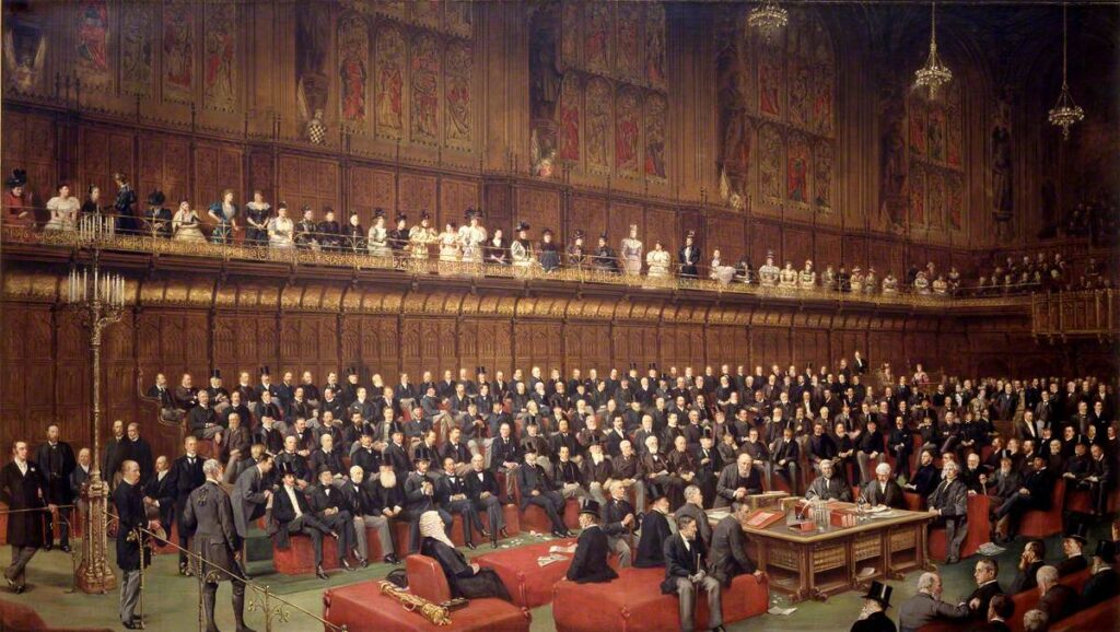 A coloured painting of the House of Lords during the Home Rule Debate, 1893. The chamber is full of peers, with the Marquess of Salisbury addressing the chamber from the despatch box. The gallery above the benches is also full of female onlookers. 