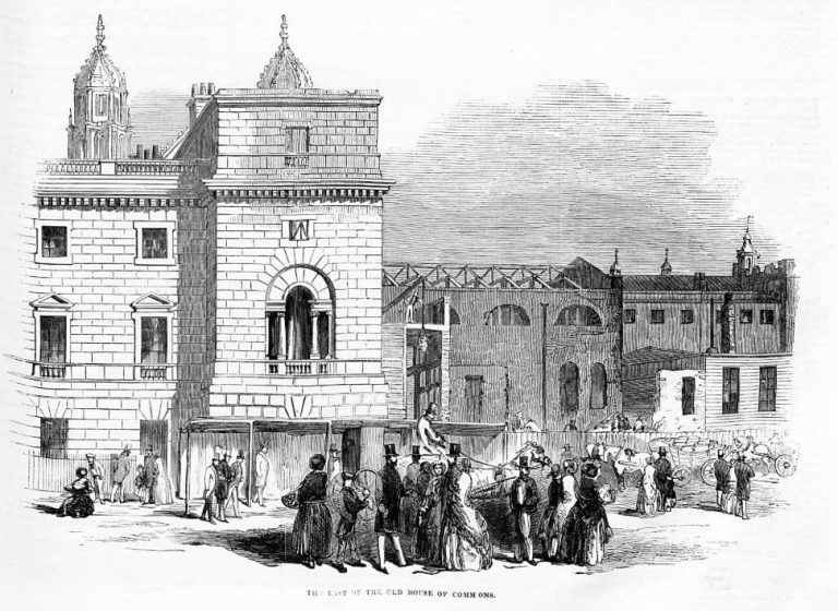 A black and white sketch of the temporary House of Commons being demolished. To the left of the picture is a three story brick building with a flat roof. In the foreground is a group of people onlooking the demolition, with men in top hats and women in frocks. Next to the the building to the left but just in the background is the temporary house of commons, noticeable by its temporary textured outside. The roof has been removed.