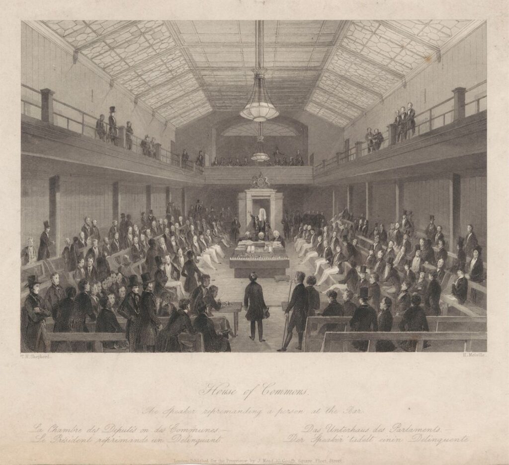A line engraving titled 'House of Commons, the Speaker reprimanding a person at the bar'. In the foreground there is a walkway into the middle of the room, with two rows of benches either side. The middle of the room has a table with the despatch boxes on top. Behind the table stands the Speaker with his wig and robe. Either side of the room are four rows of benches, with a viewing gallery above. The room is full of MPs sitting on the benches and a few viewing from the gallery.