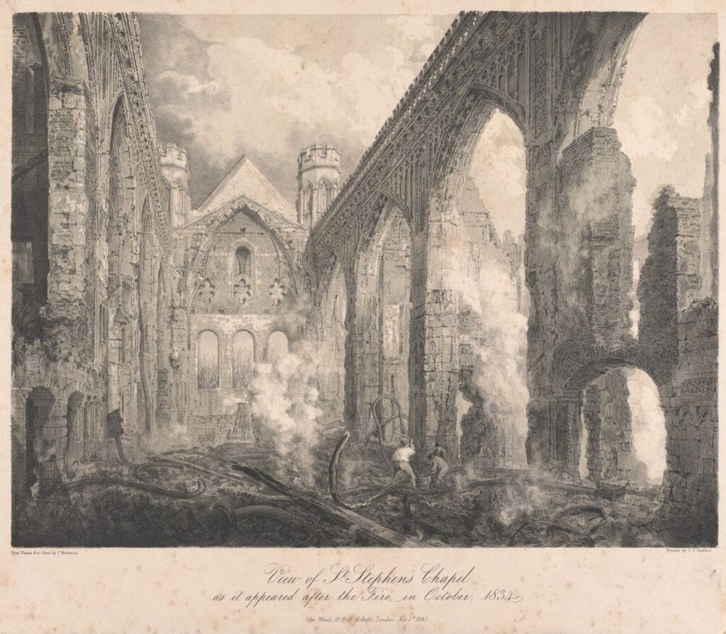 A black and white print titled at the bottom of the piece 'View of St Stephen's Chapel | as it appeared after the Fire in October, 1834'. The print depicts the ruins of St Stephen's Chapel, with the roof having completely collapsed and the tall arches on either wall being empty of glass. Their is smoke coming from the charred ruins of the floor. There are three men attempting to put out the fire.