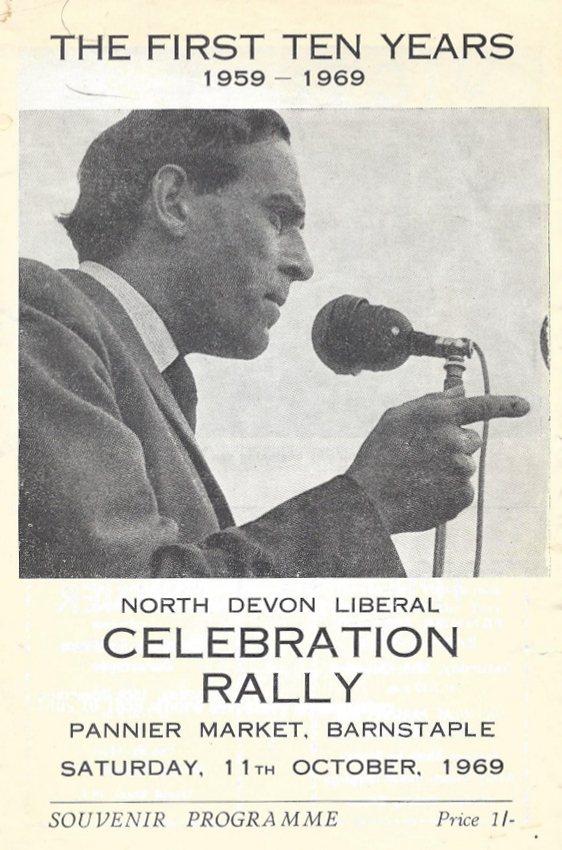 A poster with a black and white side profile photo of a man in a suit speaking into a microphone and pointing out. The text of the poster reads 'The first ten years 1959-1969, North Devon Liberal celebration rally, Pannier Market, Barnstaple, Saturday, 11th October, 1969.' 